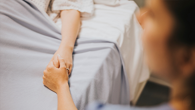 Family member keeping sick person company