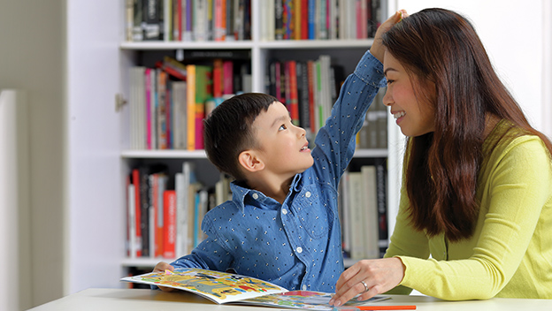 Mother and son studying