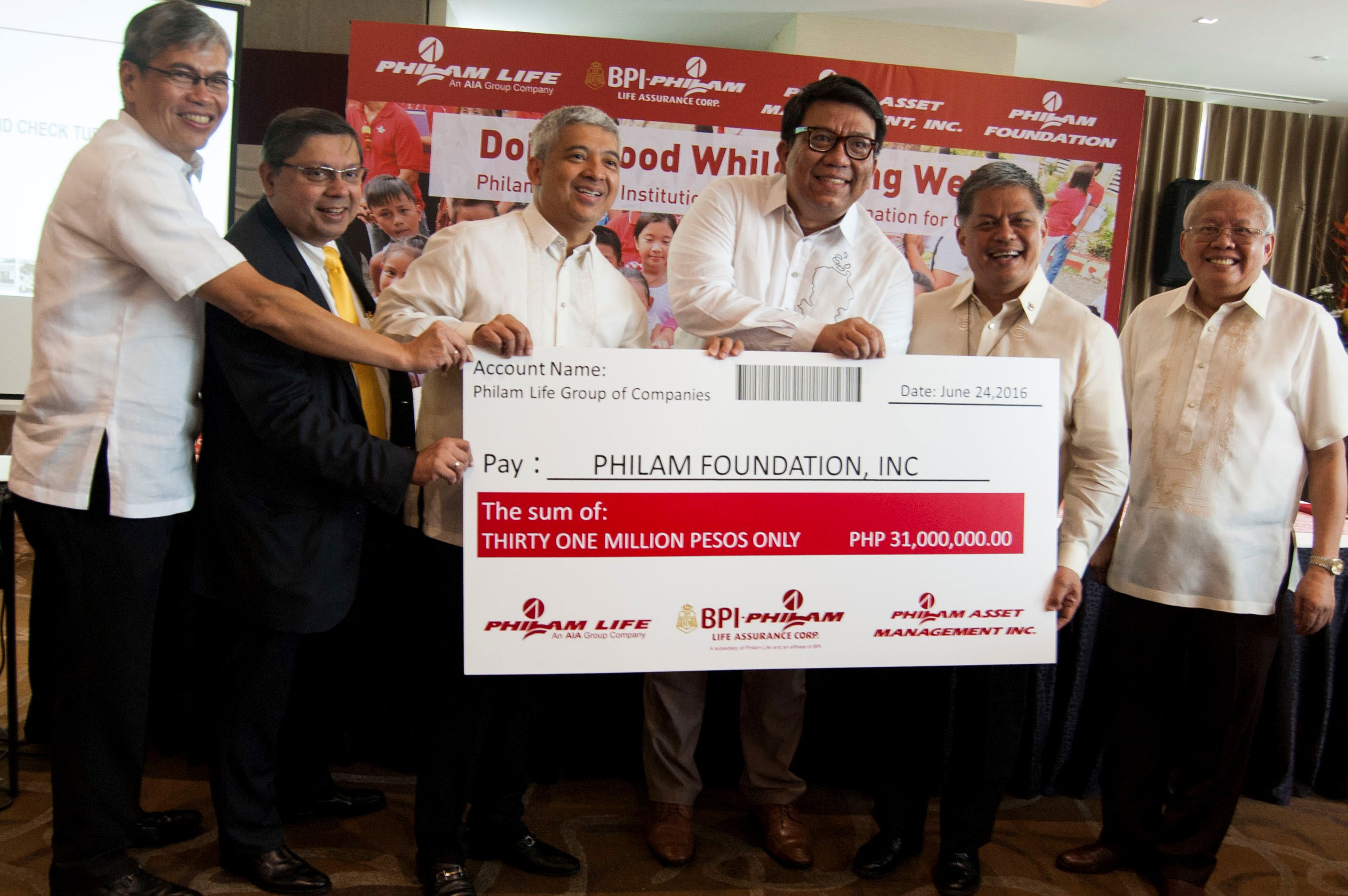 Philam Group hands over check to Philam Foundation